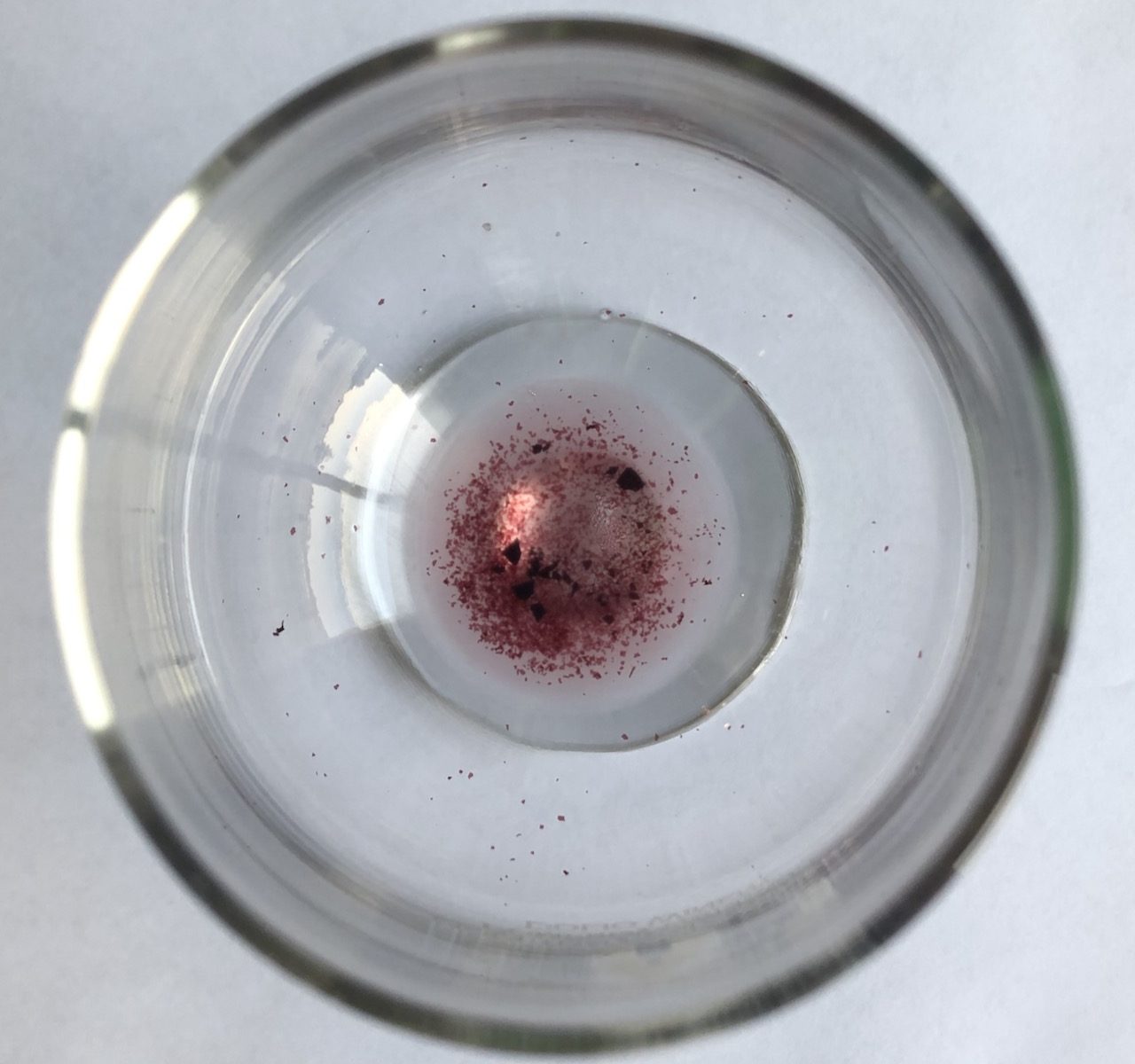 Sediment at the bottom of wine glass